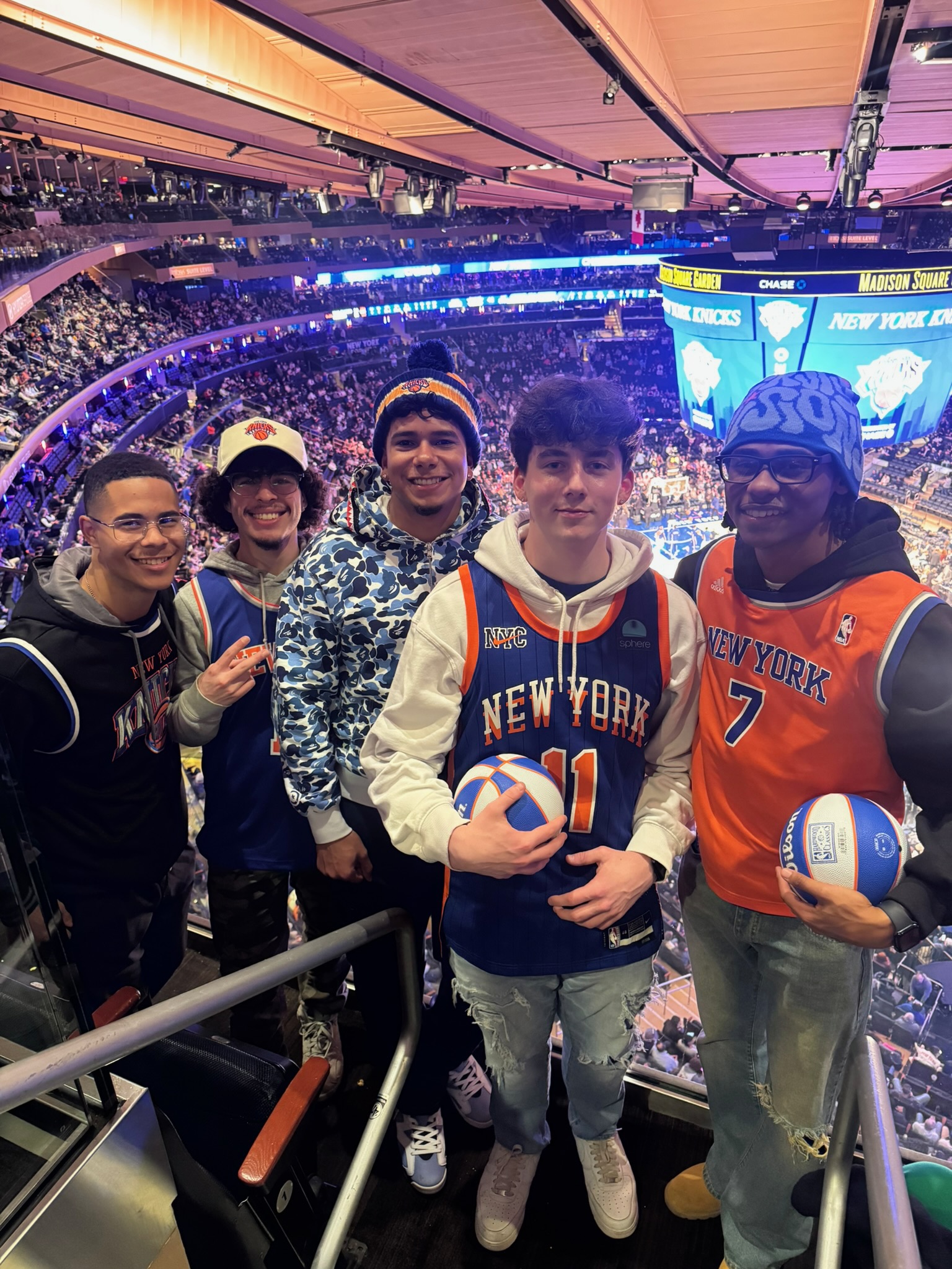 Five Skyline team members at a New York Knicks basketball game
